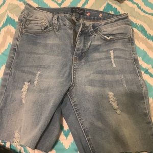 A blue shorts ripped